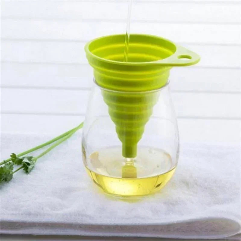 A compact, foldable silicone funnel designed for easy pouring and space-saving storage in the kitchen.