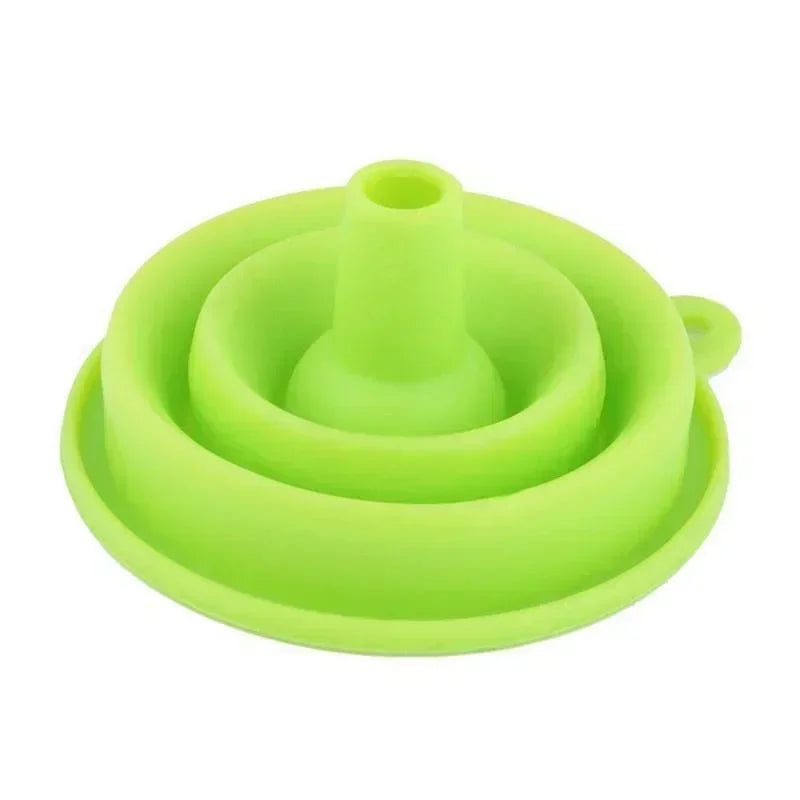 A compact, foldable silicone funnel designed for easy pouring and space-saving storage in the kitchen.