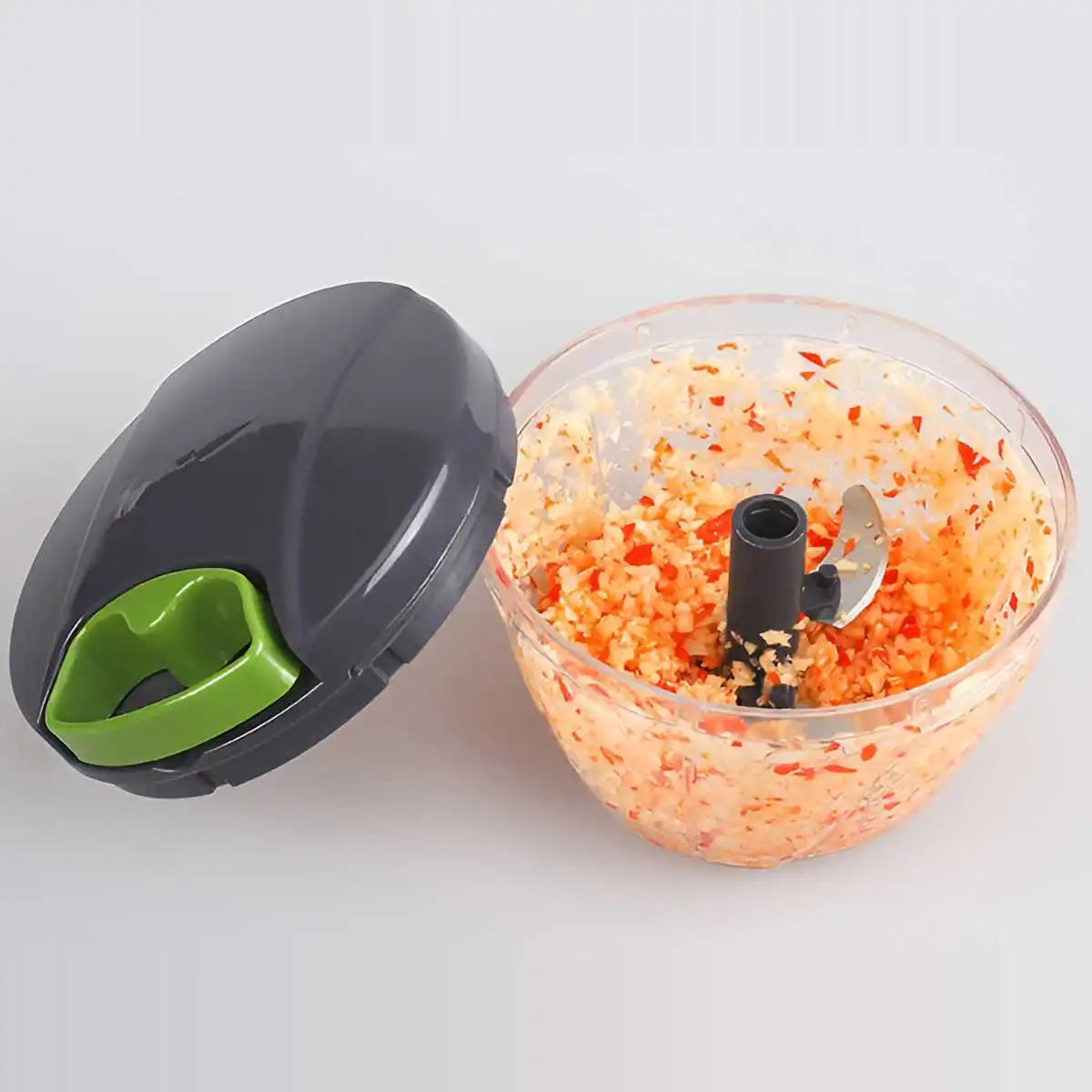 Multipurpose vegetable chopper with interchangeable blades for dicing, slicing, and grating.