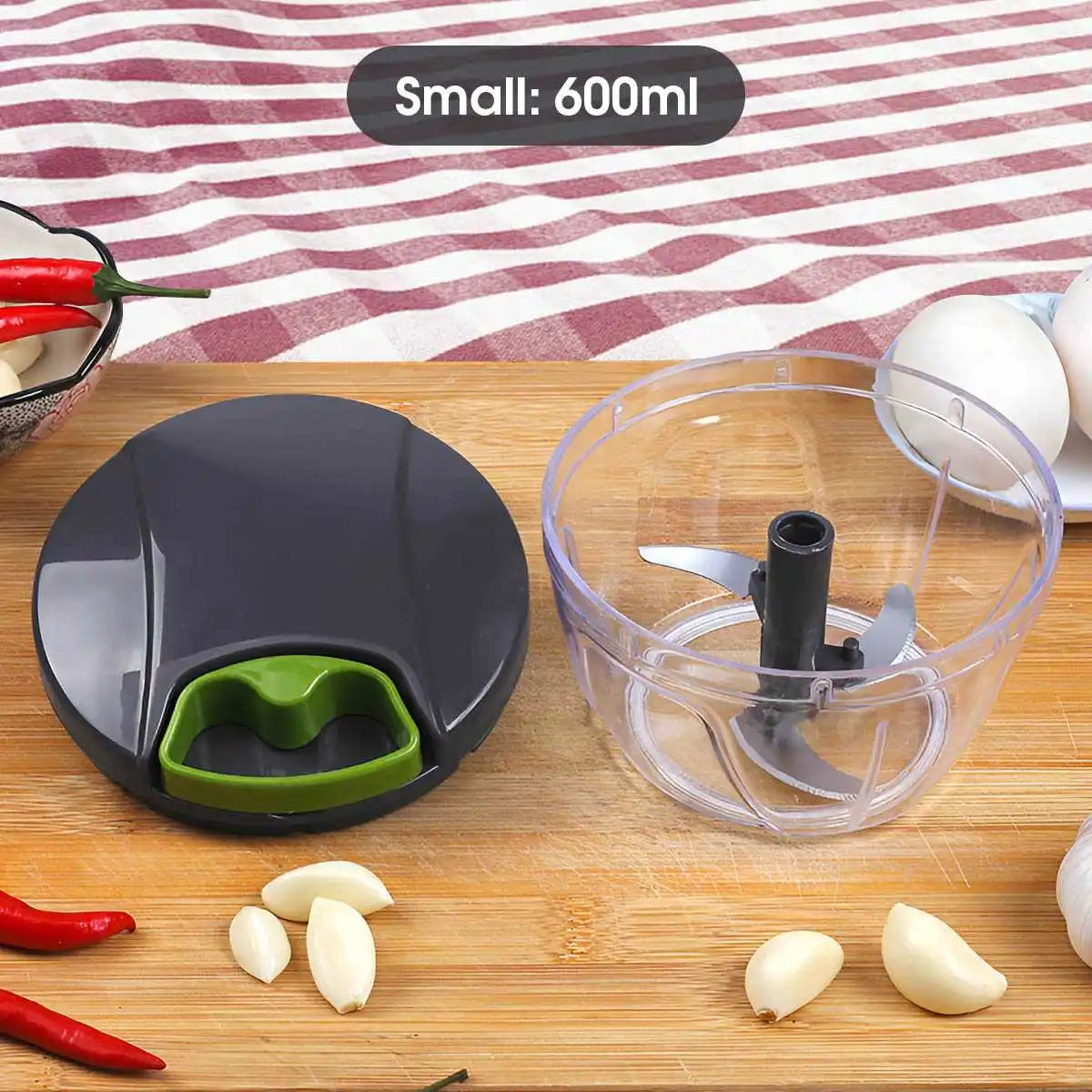 Multipurpose vegetable chopper with interchangeable blades for dicing, slicing, and grating.